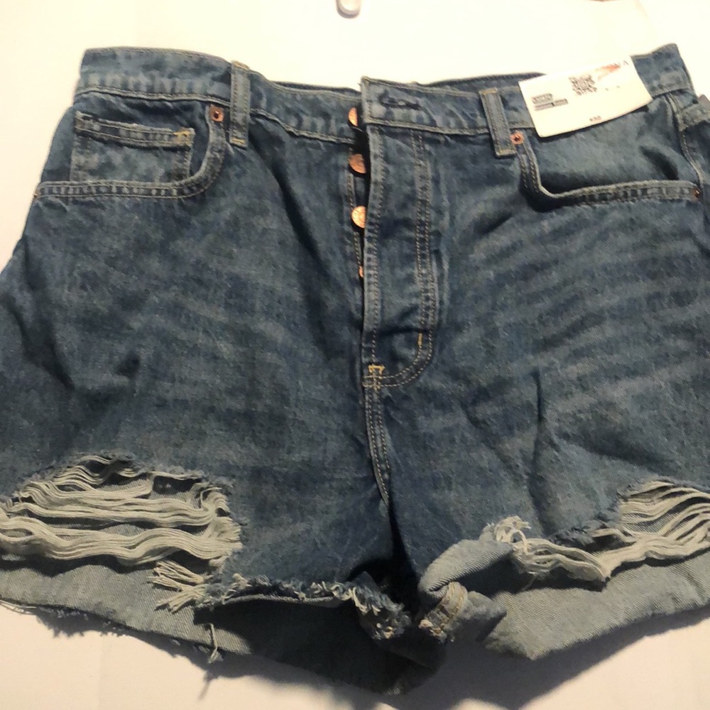 Woman’s distressed high rise button fly Jean shorts - Picture 9 of 9